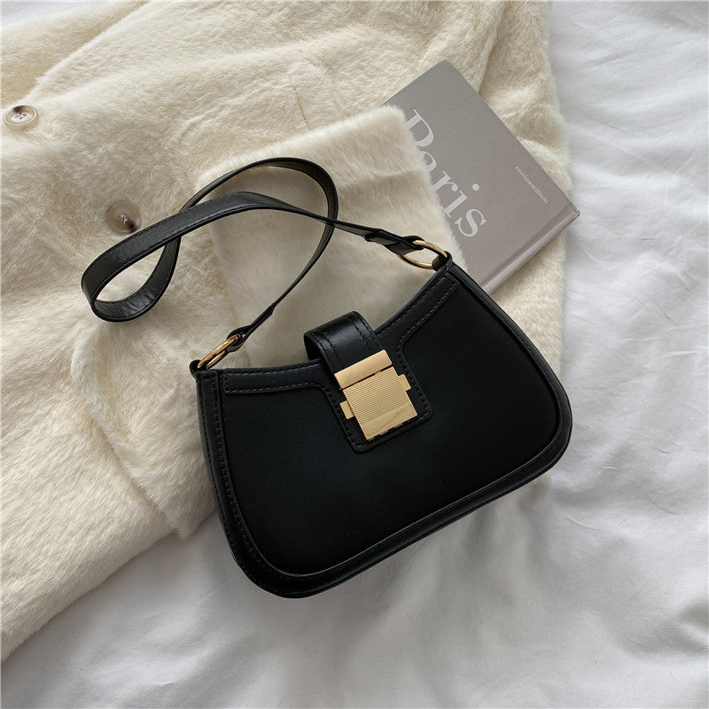 Sac Manon porté épaule, format compact, vue produit, fond neutre